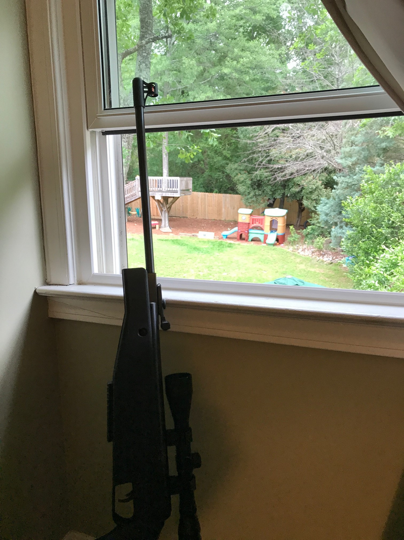 Target is between treehouse and playhouse — blue tape on black tape, mounted to 1/2" plywood.